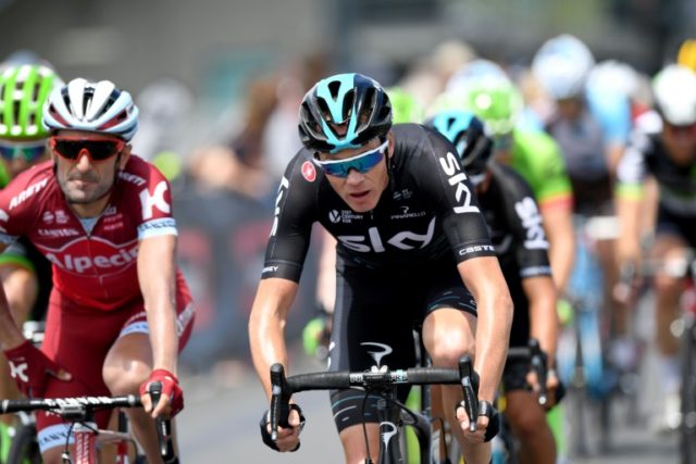 Three-time Tour de France winner Britain's Chris Froome of Team Sky (C) takes part in Race
