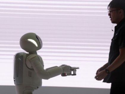 As technology-driven changes like Honda's robot 'Ashimo' redefine society's understanding