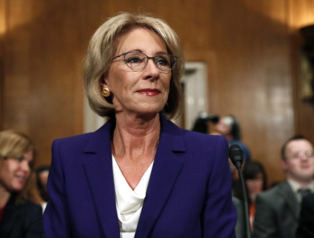 The Latest: DeVos to review for-profit college rules Photo The Associated Press