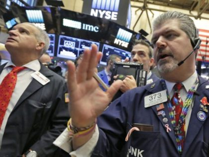 Trader John Panin, right, works on the floor of the New York Stock Exchange, Wednesday, De