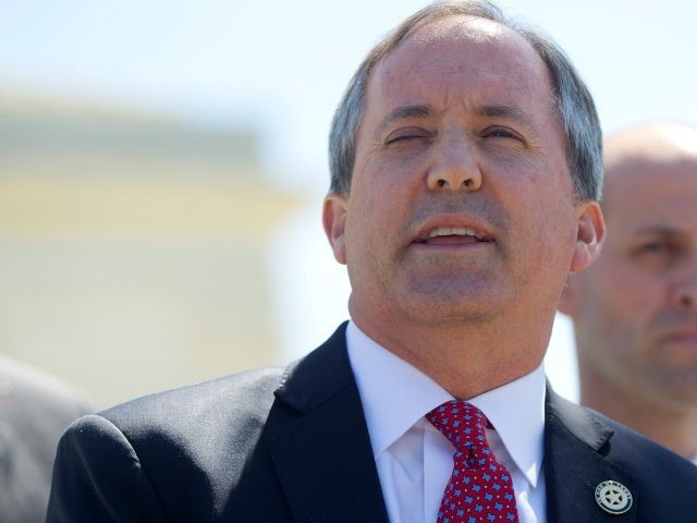 Texas Attorney General Ken Paxton, left, and Texas Solicitor General Scott Keller, right, meet with members of the media at the Supreme Court in Washington, Monday, April 18, 2016. The Supreme Court is taking up an important dispute over immigration that could affect millions of people who are living in …