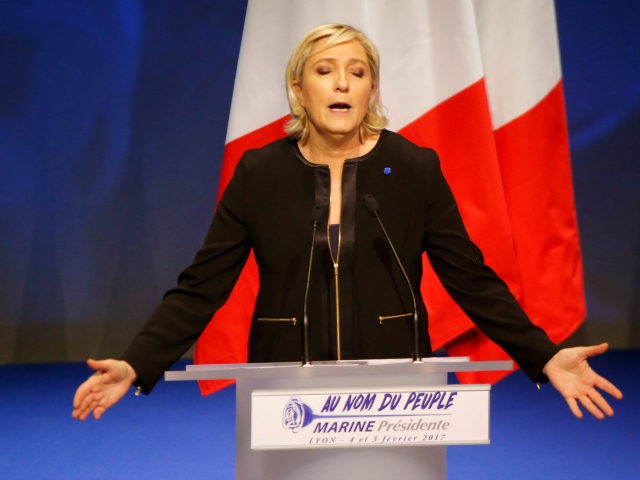 Far-right leader presidential candidate Marine Le Pen gestures as she speaks during a conf