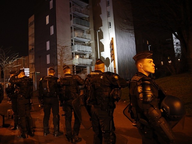 French gendarmes take positions to prevent clashes with youths in Aulnay-sous-Bois, north of Paris, France, Tuesday, Feb. 7, 2017. French police say 26 protesters were detained during an eruption of violence against police in the Paris suburbs in which a police car was torched. The violence in the night of Monday to Tuesday is a show of outrage in support of a young black man who authorities allege was sodomized by a police officer's baton last week during a police operation that targeted drug traffickers (AP Photo/Christophe Ena)