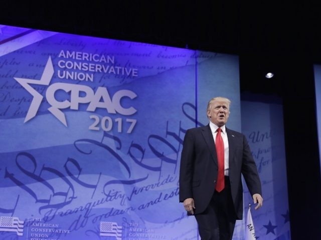 President Donald Trump arrives to speak at the Conservative Political Action Conference (C