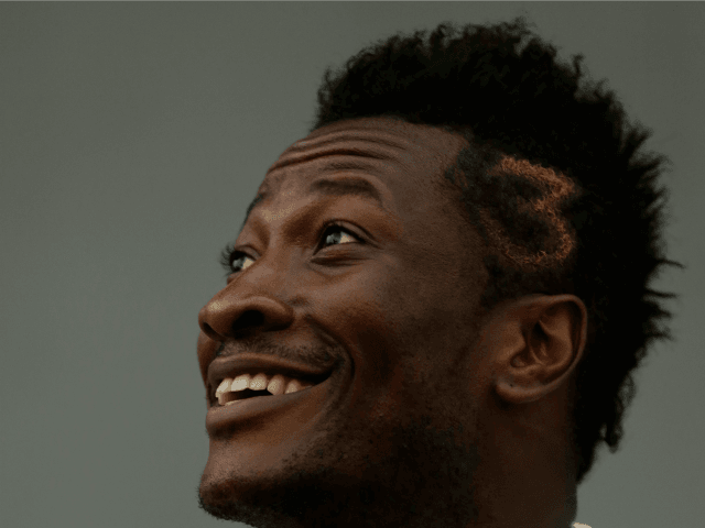 Ghana's Asamoah Gyan smiles during a training session in Bata, Equatorial Guinea, Sat
