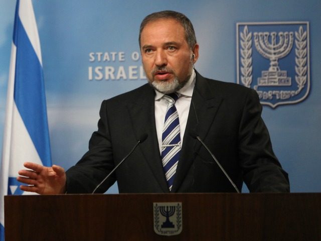 File - In this Tuesday, June 14, 2011 photo, Israeli Foreign Minister Avigdor Lieberman talks during a joint press conference with his German counterpart Guido Westerwelle, not seen, in Jerusalem. Israel's Justice Ministry filed an indictment of former foreign minister Avigdor Lieberman in a Jerusalem court on Sunday, charging him …