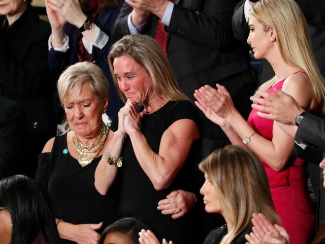 An emotional Carryn Owens, widow of widow of Chief Special Warfare Operator William “Ryan” Owens, on Capitol Hill in Washington, Tuesday, Feb. 28, 2017, as she was acknowledged by President Donald Trump during his address to a joint session of Congress. (AP Photo/Pablo Martinez Monsivais)
