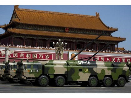 In this Sept. 3, 2015 photo, military vehicles carry DF-16 short-range ballistic missiles