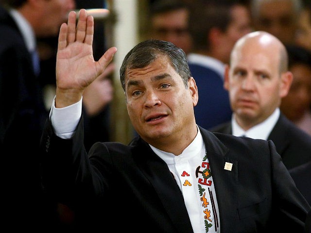 Ecuador's President Rafael Correa waves as he arrives for the taking office ceremony of Ar