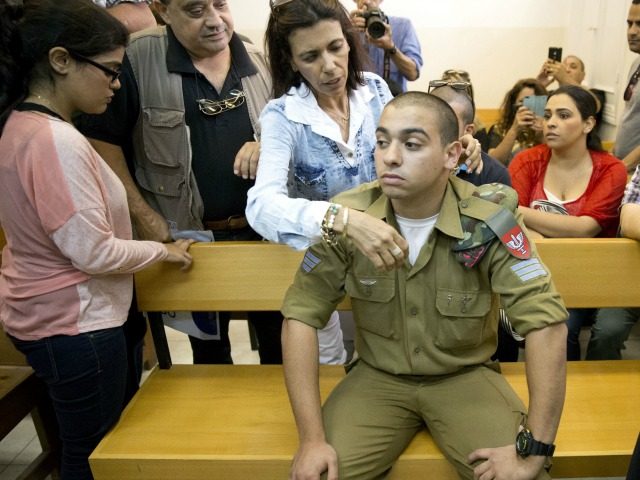 Israeli solider, Sgt. Elor Azaria, sits inside an Israeli military court in Tel Aviv, Isra