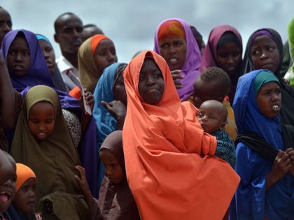 Refugees gather to watch the arrival of United Nations High Commissioner for Refugees Antonio Guterres at IFO-2 complex of the sprawling Dadaab refugee camp on May 8, 2015. Dadaab refugee camp currently houses some 350,000 people and for more than 20 years has been home to generations of Somalis who …