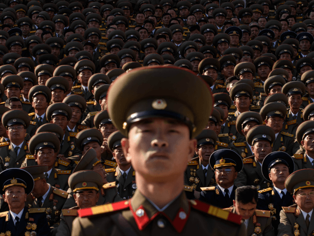 A North Korean soldiers stands before spectators during a mass military parade at Kim Il-Sung square in Pyongyang on October 10, 2015. North Korea was marking the 70th anniversary of its ruling Workers' Party. AFP PHOTO / Ed Jones (Photo credit should read ED JONES/AFP/Getty Images)