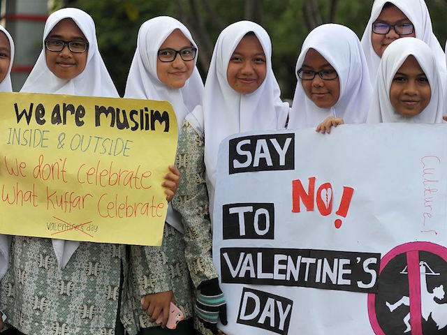 Indonesian Muslim students campaign against the celebration of Valentine's Day in Banda Aceh on February 13, 2016. Muslim clerics across Indonesia have warned against celebrating Valentine's Day, which they regard as Western celebration that promotes sex, drinking alcohol and drug use. AFP PHOTO / Chaideer MAHYUDDIN / AFP / CHAIDEER MAHYUDDIN        (Photo credit should read CHAIDEER MAHYUDDIN/AFP/Getty Images)