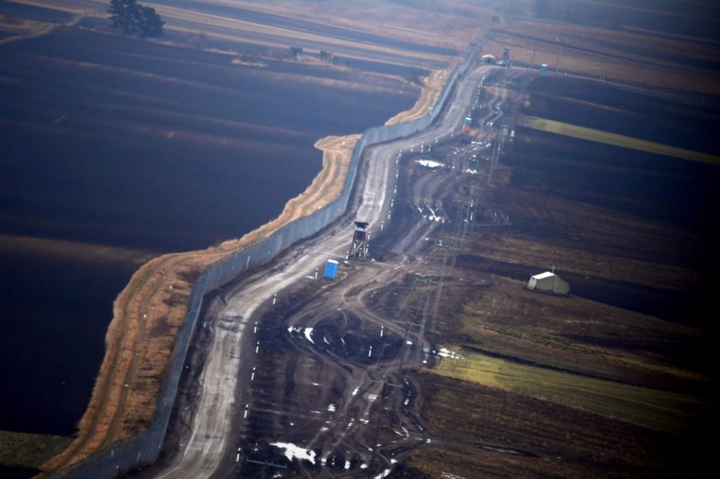 An aerial view shows the border fence near the Hungarian-Serbian border at Kelebia village on February 7, 2017. The Hungarian defence forces have been performing construction and security tasks along the whole length of the more than 300-km-long temporary security barrier since July 2015. Several thousand soldiers patrol the border sections 24 hours a day, participating in search and sweep operations and securing the surveillance of the area of responsibility with UAVs and rotary-wing aircraft. / AFP / ATTILA KISBENEDEK (Photo credit should read ATTILA KISBENEDEK/AFP/Getty Images)