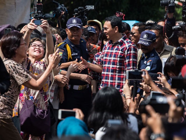 JAKARTA, INDONESIA - FEBRUARY 15: Basuki Tjahaja Purnama greets voters during his arrival