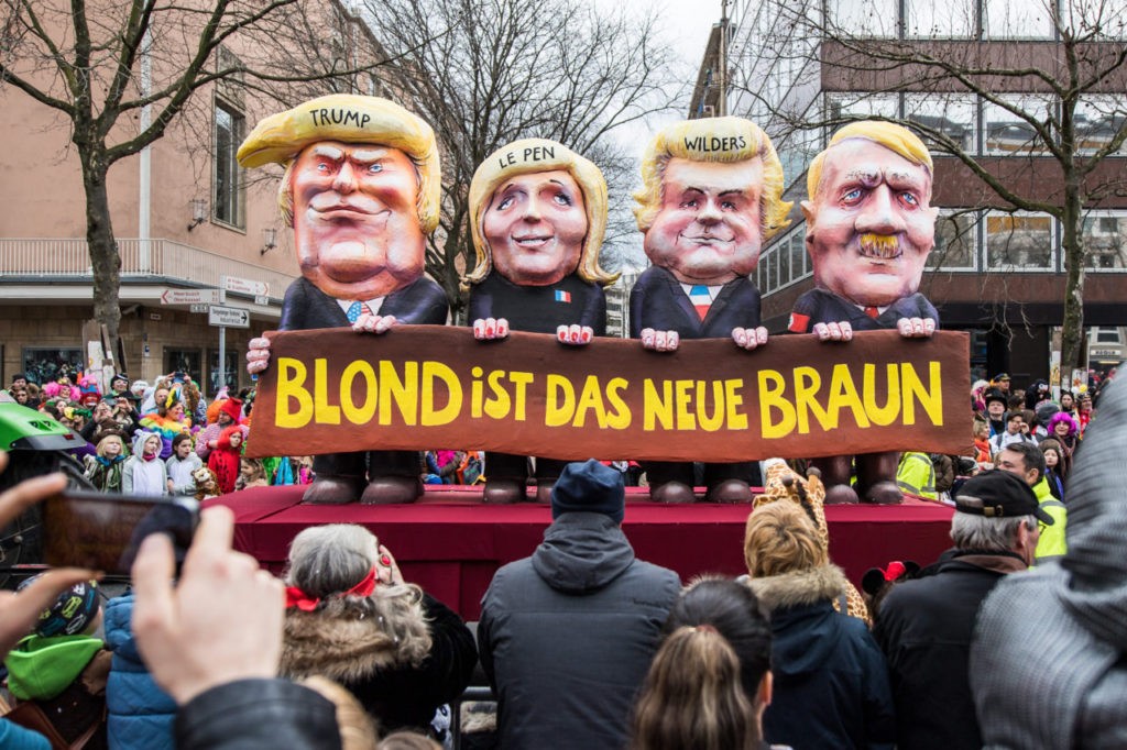 DUSSELDORF, GERMANY - FEBRUARY 27: A float featuring U.S. President Donald Trump (L-R), Marine Le Pen of Front National, Geert Wilders of Partij voor de Vrijheid and Adolf Hitler drives in the annual Rose Monday parade on February 27, 2017 in Dusseldorf, Germany. Political satire is a traditional cornerstone of the annual parades and the ascension of Trump to the U.S. presidency, the rise of the populist far-right across Europe and the upcoming national elections in Germany provided rich fodder for float designers this year. (Photo by Lukas Schulze/Getty Images)