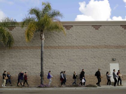 Home Depot volunteers for migrants (Gregory Bull / Associated Press)
