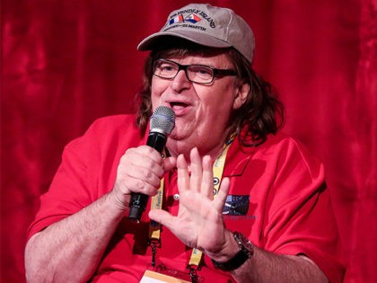 TRAVERSE CITY, MI - JULY 29: Michael Moore speaks to audience members during the screening