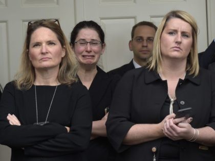 Obama White House Staff crying (Susan Walsh / Associated Press)