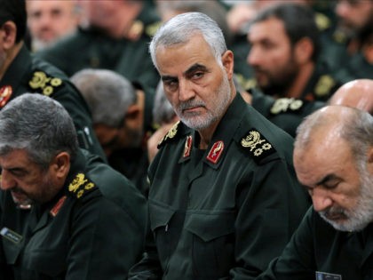 In this Sept. 18, 2016 photo released by an official website of the office of the Iranian supreme leader, Revolutionary Guard Gen. Qassem Soleimani, center, attends a meeting with Supreme Leader Ayatollah Ali Khamenei and Revolutionary Guard commanders in Tehran, Iran. As Saudi Arabia holds a naval drill in the …