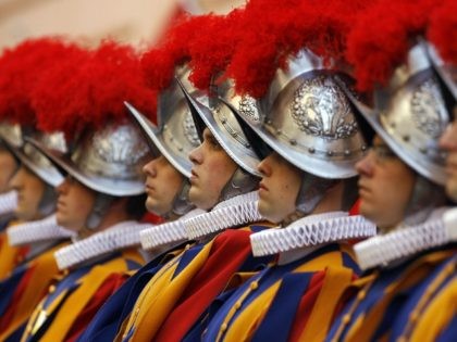 Vatican Swiss Guards stand to attention on May 6, 2008, at the Vatican. The ceremony is held each May 6 to commemorate the day in 1527 when 147 Swiss Guards died protecting Pope Clement VII during the Sack of Rome. AFP PHOTO/AP/Pool/Alessandra Tarantino (Photo credit should read ALESSANDRA TARANTINO/AFP/Getty Images)