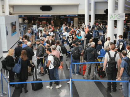 International travelers wait to have their passports checked at O'Hare International Airpo
