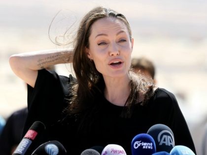 US actress and UNHCR special envoy Angelina Jolie talks during a visit to a Syrian refugee camp in Azraq in northern Jordan, on September 9, 2016. / AFP / Khalil MAZRAAWI (Photo credit should read KHALIL MAZRAAWI/AFP/Getty Images)