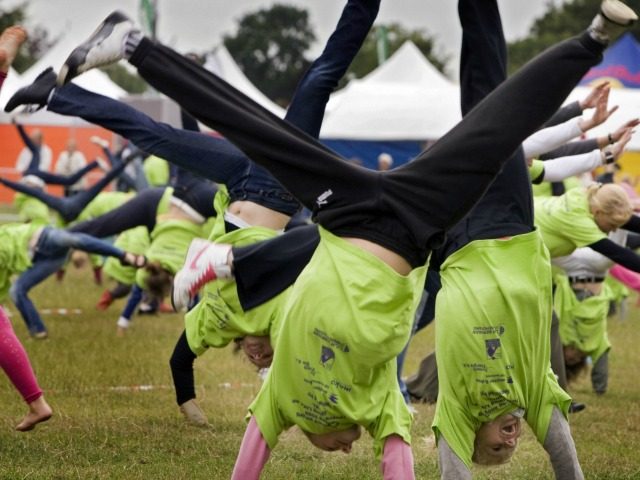 People take part in a cartwheel world record at a park in Amersfoort on July 10, 2009. 482