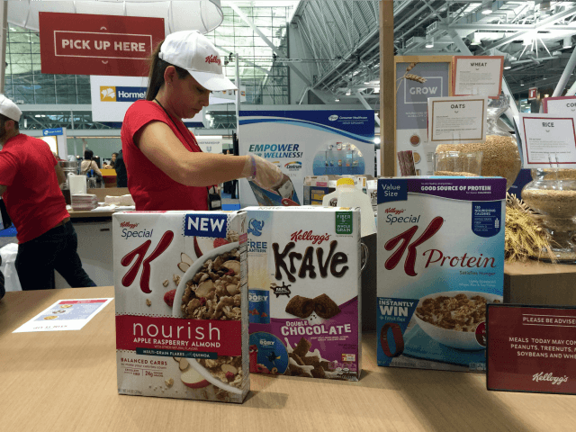 This Oct. 16, 2016, file photo shows the Kellogg booth at an annual dietitians' conference, where company representatives explained the health benefits of their products, in Boston. On its website, amid news of Pop-Tarts and Frosted Flakes, Kellogg touted a distinguished-sounding “breakfast council” of “independent experts” dedicated to guiding its …