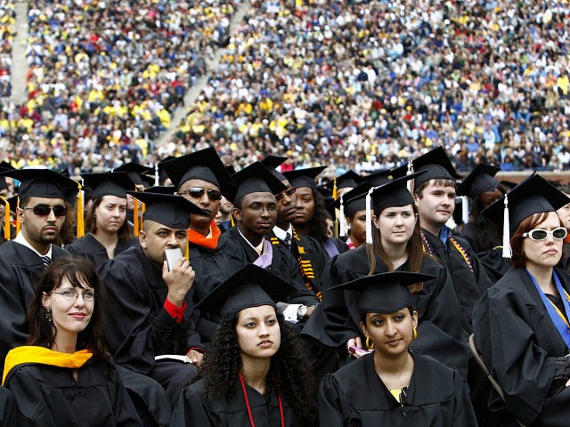 Graduating students listen to U.S. President Barack Obama speak at the University of Michigan commencement ceremony in Ann Arbor, Michigan May 1, 2010. REUTERS/Kevin Lamarque