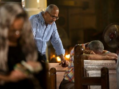 Coptic Christians grieve during prayers for the departed remembering the victims of EgyptAir flight 804 at Al-Boutrossiya Church, the main Coptic Cathedral complex, in Cairo, Egypt, Sunday, May 22, 2016. The Airbus A320 plane was flying from Paris to Cairo with 66 passengers and crew when it disappeared early last …