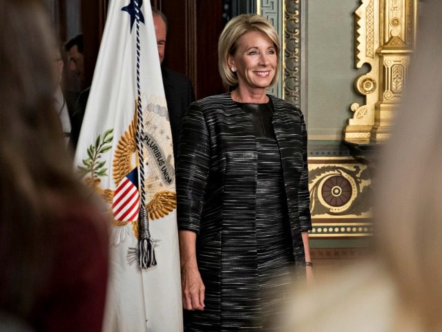 Betsy DeVos, United States Secretary of Education, arrives to be sworn in by U.S. Vice President Mike Pence, not pictured, in the Vice President's Ceremonial Office in Washington, D.C., U.S., on Tuesday, Feb. 7, 2017. DeVos squeaked through a history-making Senate confirmation vote to become U.S. education secretary, as Vice …