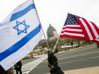 A pro-Israel demonstrators waves flags, toward the Capitol in Washington, Tuesday, March 3