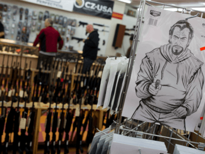 Targets and racks of long guns are seen at a gun shop on November 5, 2016, in Merrimack, N