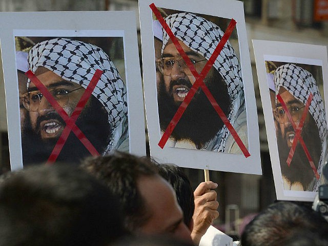 Indian activists carry placards of the chief of Jaish-e-Mohammad, Maulana Masood Azhar dur