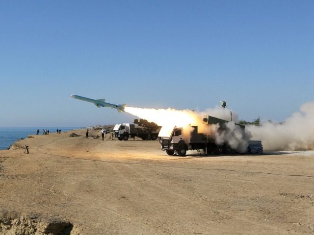 A Ghader missile is launched from the area near the Iranian port of Jask port on the shore