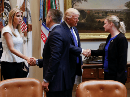 President Donald Trump greets Holly Gibbs, a survivor of human trafficking and director of Dignity Health's Human Trafficking response Program, as his daughter Ivanka Trump greets Gary Haugen, CEO and founder of International Justice Mission, prior to the start of a meeting on domestic and international human trafficking, Thursday, Feb. …