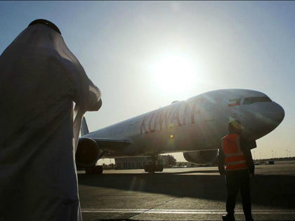 Kuwaiti civil aviation officials look at the first Boeing 777-300ER ordered by Kuwait Airw
