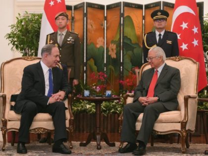Israeli Prime Minister Benjamin Netanyahu, left, sits with Singapore President Tony Tan at