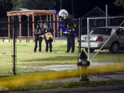 Police gather evidence after a shooting at a playground on November 22, 2015 in New Orlean