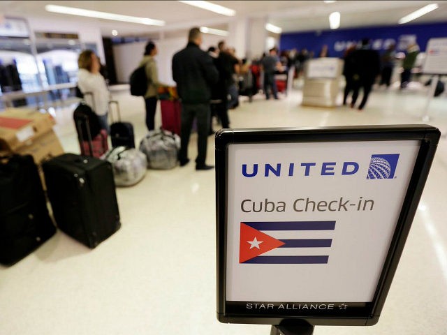 Passengers wait in line to check in for United Flight 1502 for the first direct passenger flight from Newark Liberty International Airport to Havana, Cuba, Tuesday, Nov. 29, 2016, in Newark, N.J. Commercial flights between the United States and Cuba resumed several months ago as relations between the two countries …