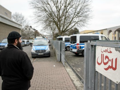 FRANKFURT AM MAIN, GERMANY - FEBRUARY 01: A Muslim man stands outside the Bilal mosque in Griesheim district while police investigate inside on February 1, 2017 in Frankfurt, Germany. Approximately 1,000 police officers were involved in the anti-terror raids of 54 residences, apartments and businesses across the state of Hesse. …