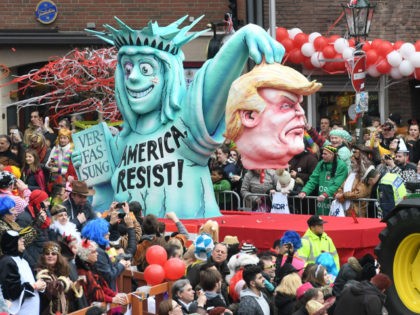 A float showing US president Donald Trump and the Statue of Liberty are seen at the Rose M