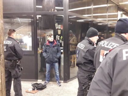 Austrian Identitarian leader Martin Sellner talks to police after being attacked by left-wing extremists.