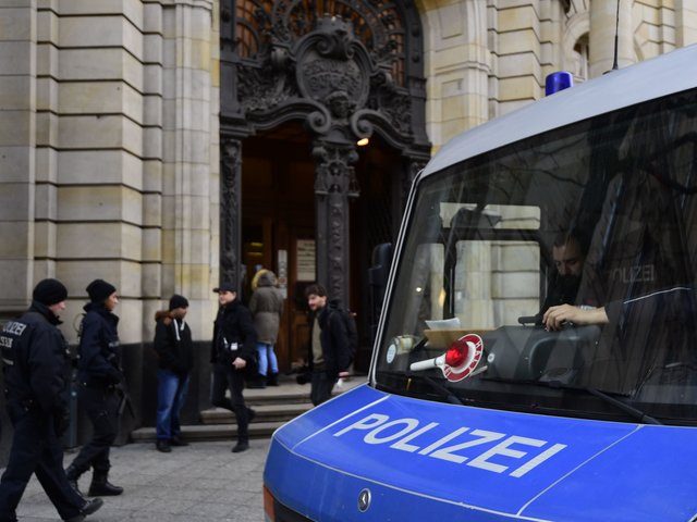 Policemen secure the area in front of Berlin's Supreme Court, where is starting a trial against alleged Islamic State jihadist Shaas Al Mohammad on January 4, 2017 in Berlin. The defendant, a 19-year-old Syrian national, is accused of scoping out potential targets for an attack in Berlin, including the Brandenburg …