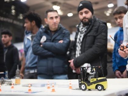 Visitors attend the second edition of a job fair for refugees and migrants on January 25, 2017 in Berlin. According to the organisers, about 200 companies and consulting and aid oranisations give career advice, provide informations on how to find job offers and vocational training and help to give insight …