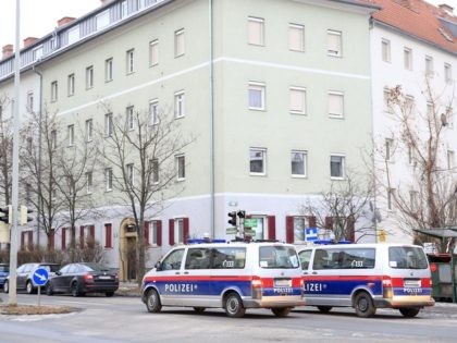 Police cars are pictured during a raid against possible members of the Islamic State jihadist group in Graz, on January 26, 2017. Fourteen people were arrested in Austria as some 800 police investigating possible members of the Islamic State jihadist group. / AFP / APA / ERWIN SCHERIAU / Austria …