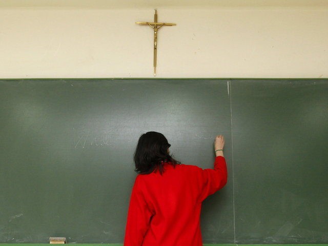 A crucifix hangs on the wall of a classroom in a school of the city of Burgos, northern Sp