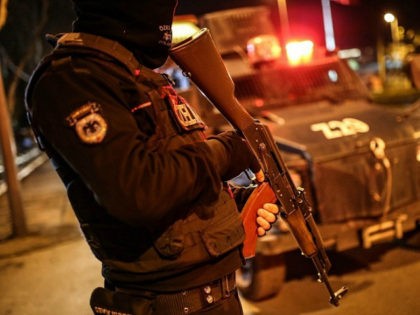 ISTANBUL, TURKEY - JANUARY 31: A special operation police holds an AK-47 during simultaneous anti-drug operations to 100 locations in Sarigol, Gaziosmanpasa district of Istanbul, Turkey on January 31, 2017. Many suspects were detained and various types of drugs, ammunition and weapons captured within the biggest anti-drug operation held in …