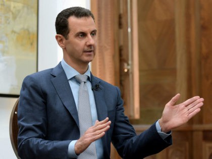 In this photo released by the Syrian official news agency SANA, Syrian President Bashar Assad speaks during an interview with Yahoo News in Damascus, Syria, Friday, Feb. 10, 2017. Assad said, there are "definitely" terrorists among the millions of Syrians seeking refuge in the West. He said it doesn't have …